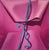 Pink Package by Sarah van der Helm | Oil on Cradled Panel close-up of a pink gift wrapped with blue ribbon For Sale