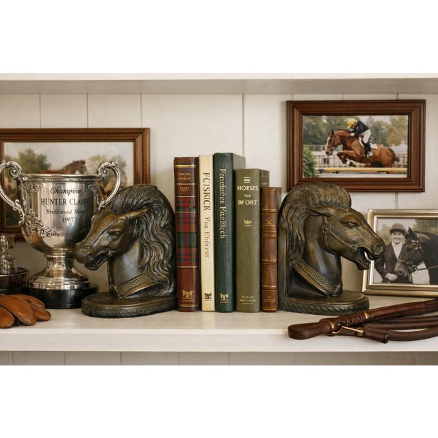 Bring sculptural elegance and mid‑century charm to your shelves with this vintage signed pair of BMR cast bronze horse...