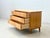 Elegant vintage mid-century chest of drawers with three spacious drawers. The design is characterized by its clean,...