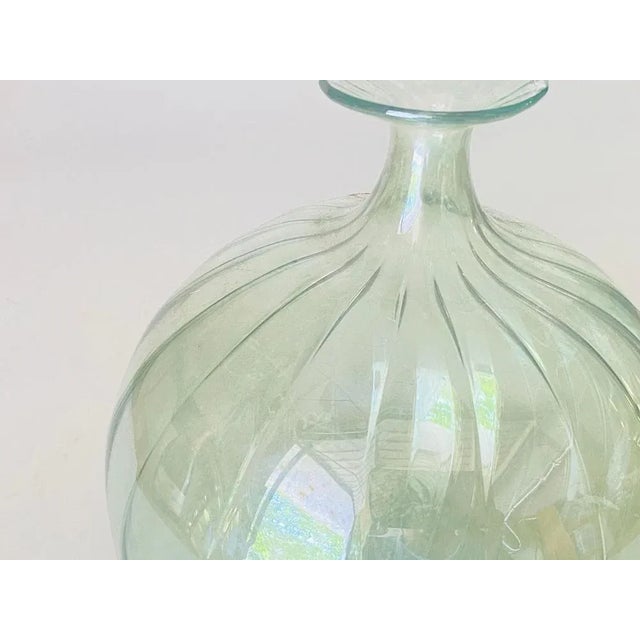 This is a production by Venini, Italy, 1970. A 'vetro soffiato' glass vase in yellow transparent glass with slightly...