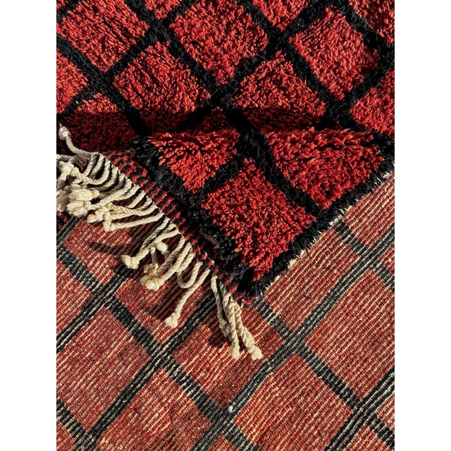 This exceptional Mrirt Moroccan rug is a handcrafted wool carpet woven in the Middle Atlas Mountains by experienced Berber...