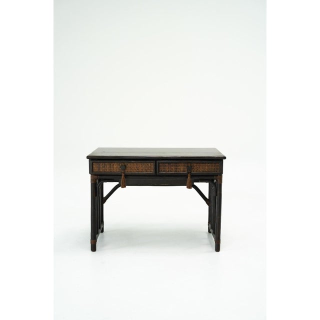Vintage dark-stained bamboo vanity or writing desk in the Chinoiserie taste. The rectangular top lifts to reveal a built-...