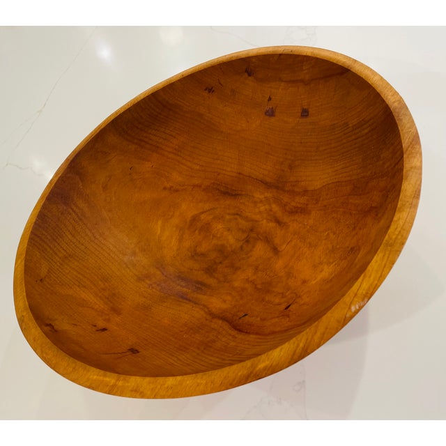 Exquisite hand-turned cherry wood bowl made from a single piece of wood, meticulously crafted by G.C. Granville, a...