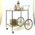 RELOCATION SUPER SALE! HUGE MARK DOWNS This chic faux bamboo brass bar cart with two-tiered tinted glass shelves brings a...