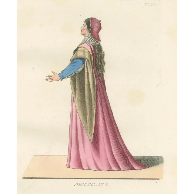Antique 1845 Hand-Colored Print of a Medieval Woman in Pink and Gold Cape This elegant hand-colored engraving from 1845...
