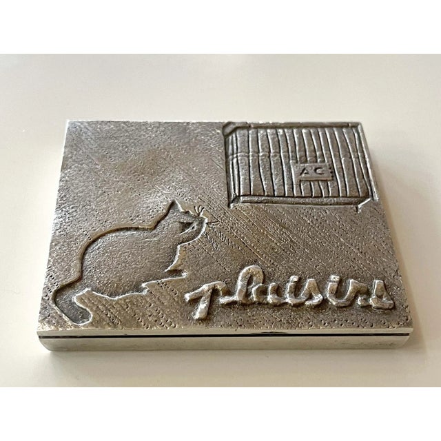 A silvered cast bronze rectangular paperweight by Parisian art jeweler Line Vautrin (1913-1997) circa 1940s. A lovely...