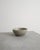 A rare and iconic light grey Danish mid century stoneware bowl with decorative and vertical grooves by Arne Bang produced...