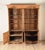 A handsome antique English pine breakfront bookcase. Formerly built into a wall, now a freestanding cabinet. 19th century...