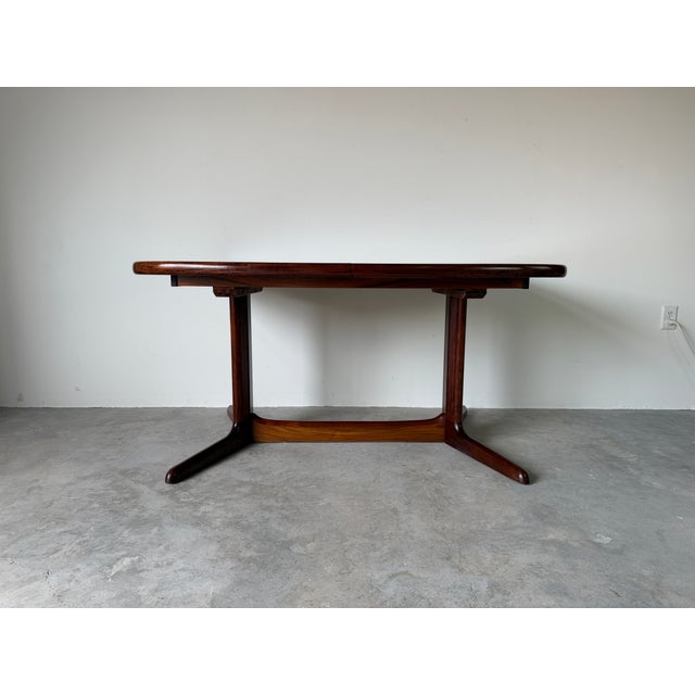 Beautiful vintage Mid Century Modern Danish dining table by Rasmus, crafted in Denmark and showcasing the timeless...