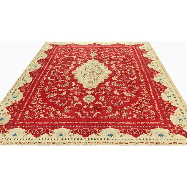 ACTUAL SIZE: 10’8″ x 14’4″ PRIMARY COLOR: Red / Gold AGE: Old MATERIALS: Wool FOUNDATION: Cotton PRODUCTION: Handwoven,...