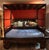 Gorgeous Chinese wedding bedframe featuring intricate decorative carvings, a mirrored sideboard, cabinets and shelving for...