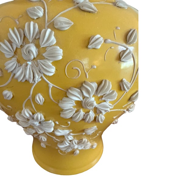 Bring warmth and timeless elegance to your home with this striking vintage porcelain table lamp dating to approximately...