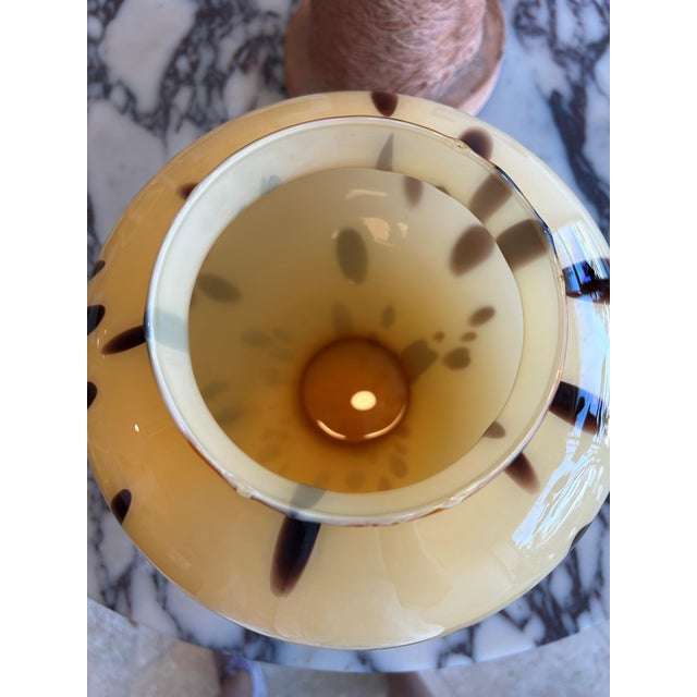 Hand blown in Italy, this vintage glass vase features a striking tortoiseshell pattern with layered amber, brown, black,...