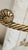 Elegant vintage countertop guest-towel stand featuring two gracefully curved, twisted-rope arms ending in sculptural...