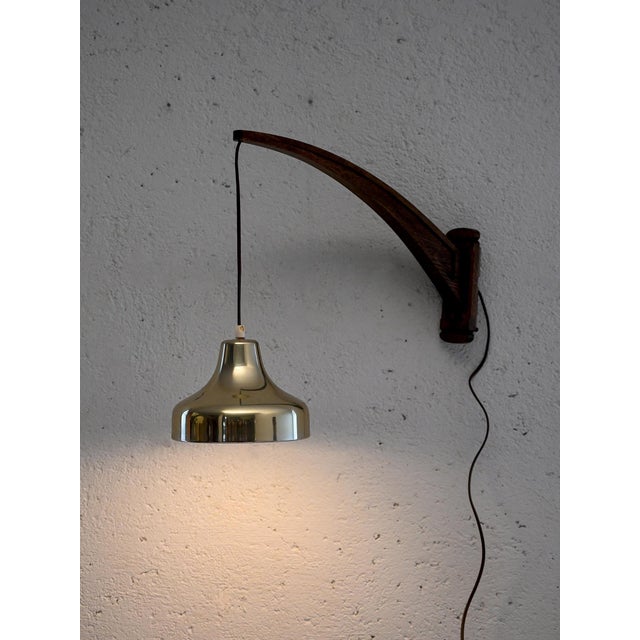 Scandinavian vintage walnut wall light with pendant brass lampshade and adjustable cable. Scandinavian vintage walnut wall...
