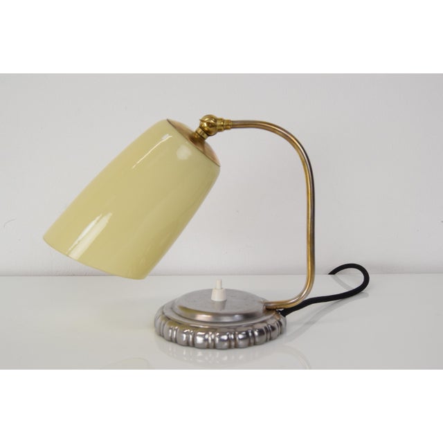 Made in Czechoslovakia. Made of glass, brass, metal. with aged patina. Adjustable shade. Was installed with new wiring....