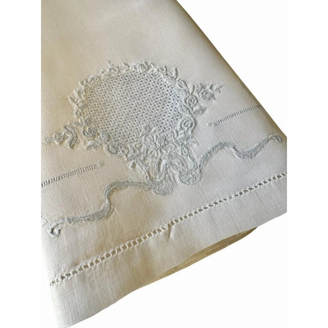 "An exceptionally sweet and finely crafted vintage linen guest towel, featuring a hand formed drawn thread medallion...