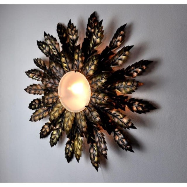 Superb and rare sun wall or ceiling lamp, designed and produced in Italy in the 1970s. This unique object is composed of...