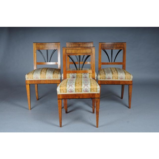 Set of 4 impressive Biedermeier chairs made of cherry wood and ebonized around 1840 Solid wood with cherry wood veneer....