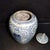Sold as a matching pair of Chinese melon‑shape lidded jars. Finished in classic blue‑and‑white porcelain, densely...