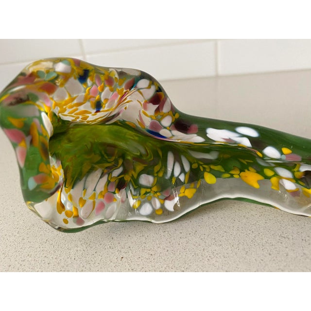 Artist-blown "end of day" flower in multi-colored glass. In glass hotshot tradition, artists finish their day's work with...