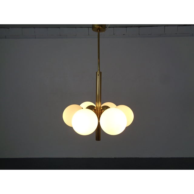 Kaiser Sputnik lamp made of brass and 6 opal glass balls from the 1960s. This piece has an attribution mark, I am sure...