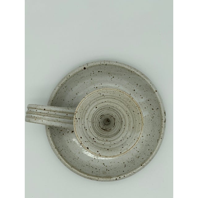 Soft white reactive glaze with speckled natural brown design. Vintage signed chamber stick candle holder. Lovely to style...