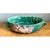 This bowl showcases Roseville's celebrated botanical relief work, its elongated rectangular form softened by a gently...
