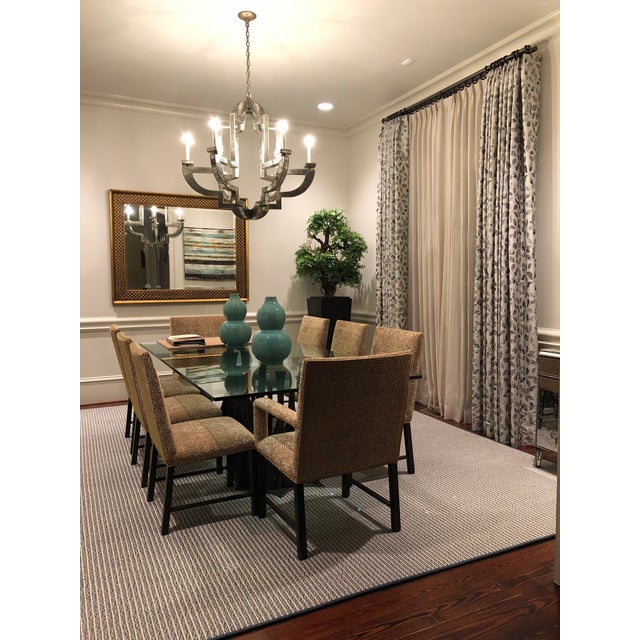 An elegant Niermann Weeks Large Lido chandelier featuring antiqued mirror panels set within a sculptural metal framework....