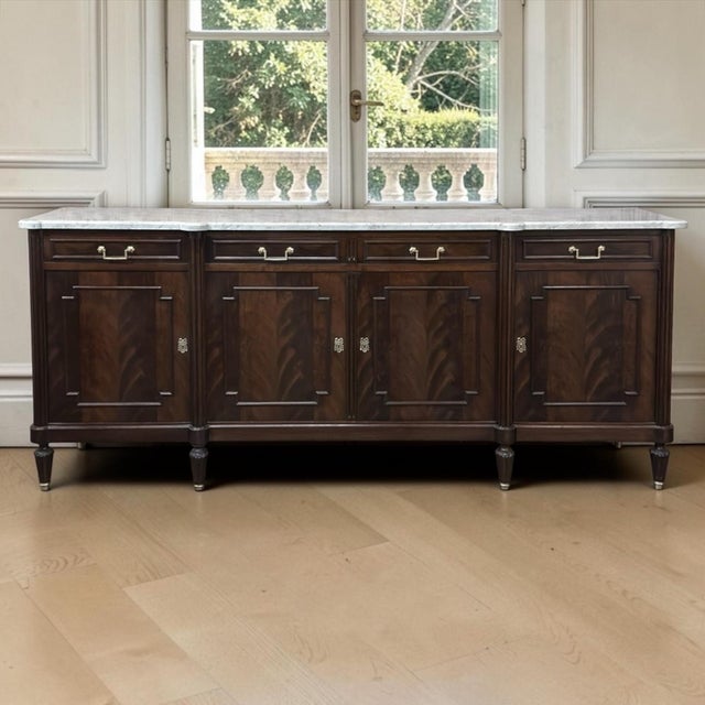 This French Louis XVI style buffet embodies the symmetry, refinement, and accomplished cabinetmaking of the neoclassical...