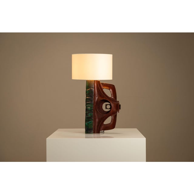 Created in the 1970s, this sculptural lamp showcases a tension between precision and expression. design carved entirely...