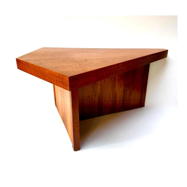 An exceptionally distinctive vintage coffee table with a symmetrical triangular top, clipped corners, and an angular...