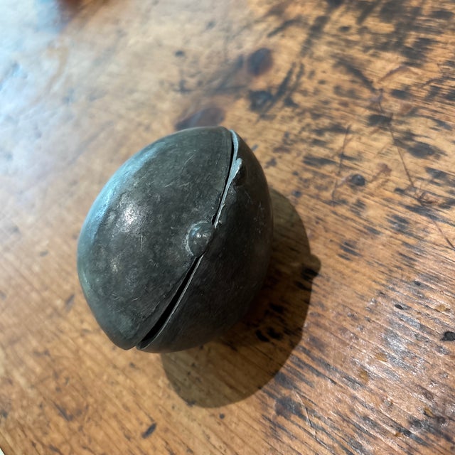 Vintage egg pewter mold, likely used for making ice cream or chocolate or candy in the shape of an egg. It features a...