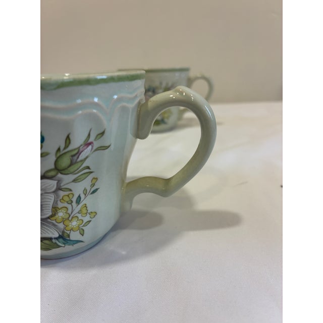 Vintage set of four Provistone Rose Marie ceramic mugs made in Japan featuring embossed detailing and soft floral patterns...