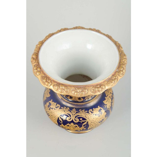 Rosenthal Vase Ca. 1940s. Decorative porcelain vase with deep cobalt blue glaze and rich gilded floral motifs. Elegantly...