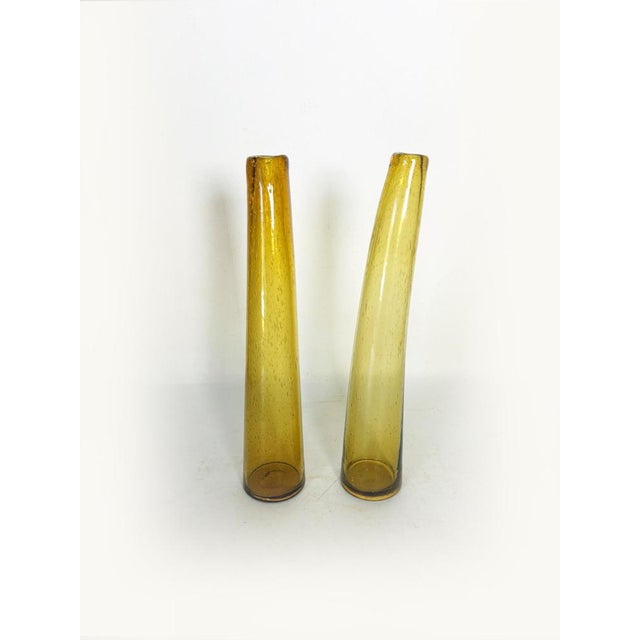Pair of vintage hand-blown glass vases from the Biot glassworks, recognizable by their fine air bubbles trapped within the...