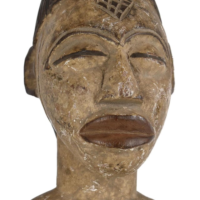 The Punu are most famous for their numerous white-faced female masks with scscarification patterns and elaborate hairdos....