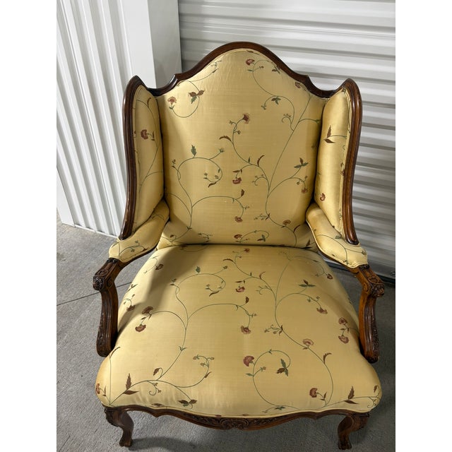 Pair of French Provincial Carved Walnut Bergeres, Late 19th Century. Upholstered in silk fabric