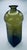 This is a hand-blown glass in a rich olive green color. It features a sleek, mid-century modern Scandinavian design. The...