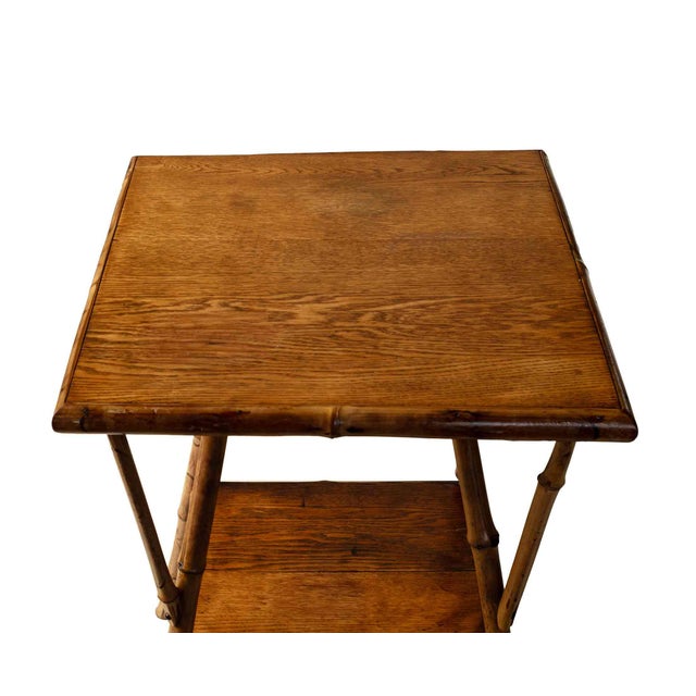 Antique Victorian bamboo side table with oak tiers on splayed legs with triangular supports.