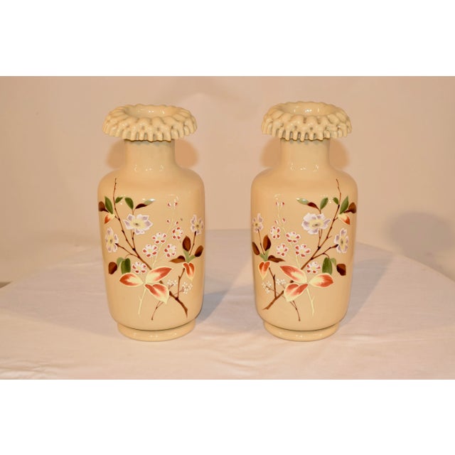 19th century pair of French opaline glass vases with very interesting molded tops. The vases have hand painted decorations...