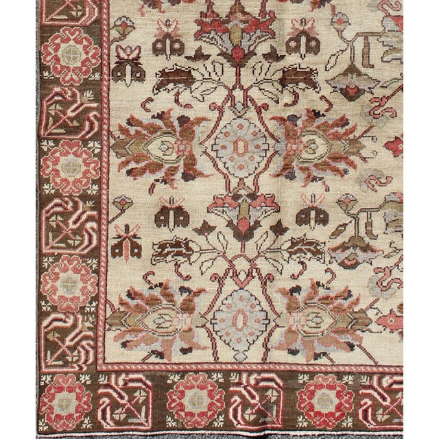 Produced in mid-20th century Turkey, this antique Oushak is characterized by a comely and highly representative Oushak...
