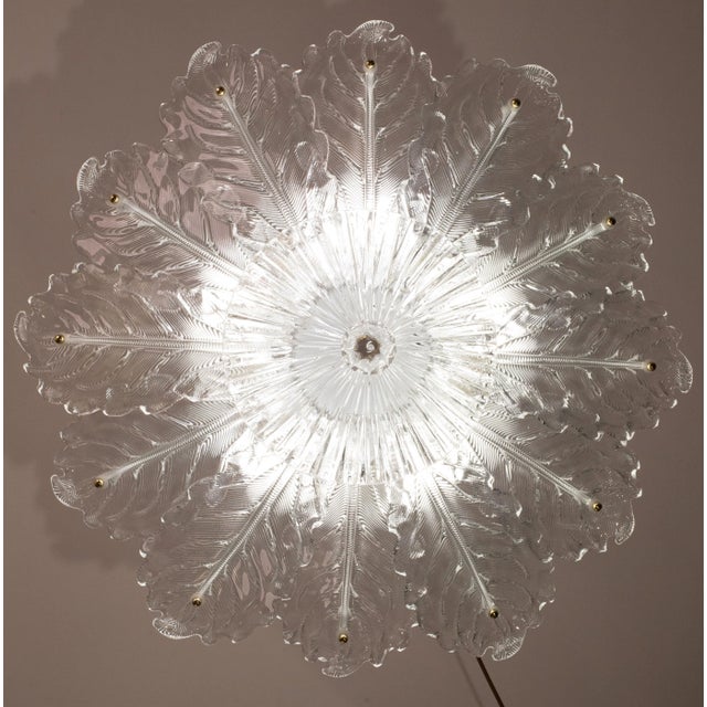 Gorgeous Large size clear glassMurano ceiling light. The ceiling light consists of a round of alternating leaves and...