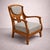 An elegant Italian Art Nouveau armchair from the early 20th century, crafted from oak, featuring a harmonious structure...