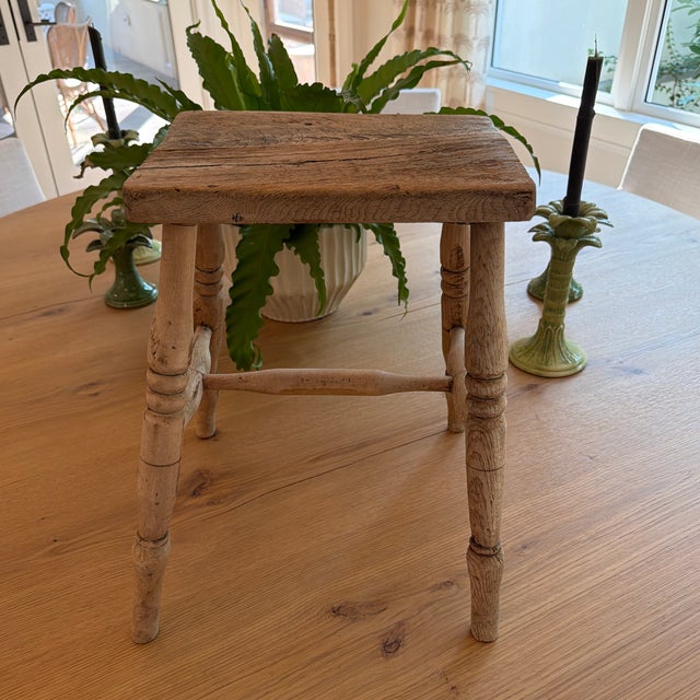 A fantastic 19th century English wood stool with turned legs. The weathered finish and patina makes this especially...