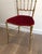 This rare set of a brass Chiavari chair and its stool or ottoman with seats covered in red velvet. This is an Italian...