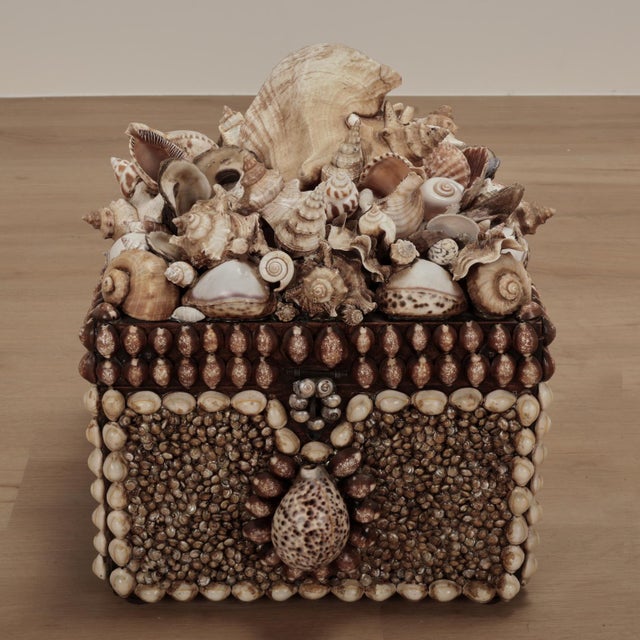 Lofty large one of a kind lidded mahogany box transformed into a exotic seashell fantasy in an ambitiously assembled...