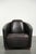 This Aviator design armchair is made of grained cowhide leather in a dark color scheme and has a distinctive look. The...