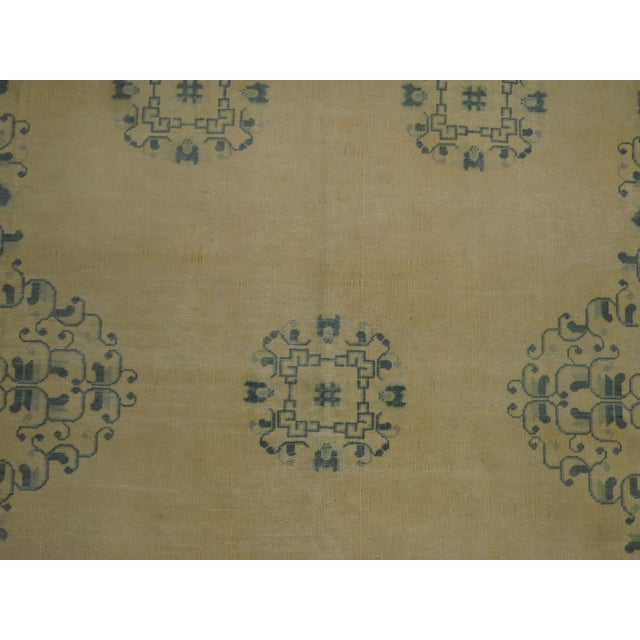 One of a kind, early 20th-century Hand-knotted midsize Chinese Rug with a bone color field accents in light blue....
