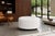 Mid-century modern round ottoman manufactured in the United States, circa 1960s. This sculptural piece captures the...